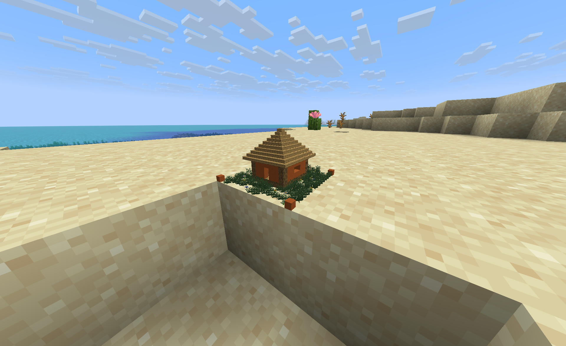 A tiny hut with a grass base, built as a single custom pixel block
